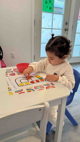 Child doing colour-matching at table